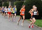 Jennifer Meadows (Wigan and District AC) leads from Rosie Smith (Durham City) on the first leg of the Northern Womens 4 Stage Road Relay.